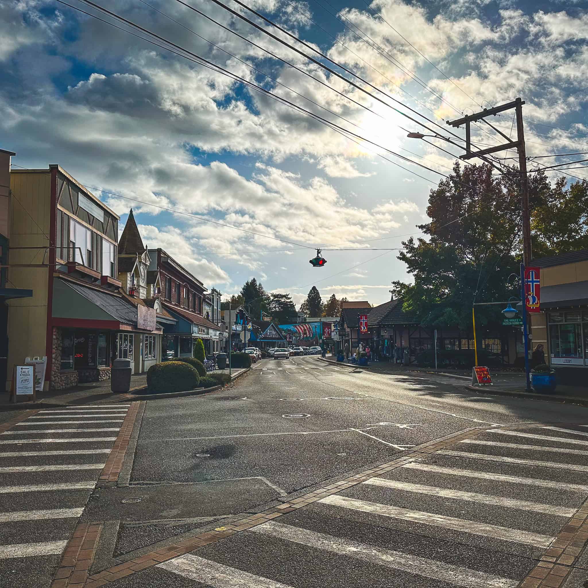 Scenic view of Poulsbo's downtown with shops and cloudy sky.
